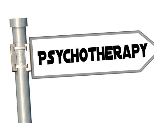 Signpost with inscription pointing to the right with "psychotherapy" written on it.